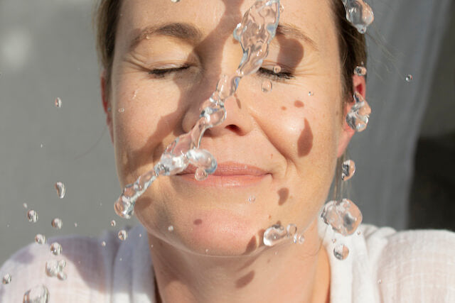 Top 10 Home Remedies for Dry Skin According to Reddit - Woman holding manuka oil