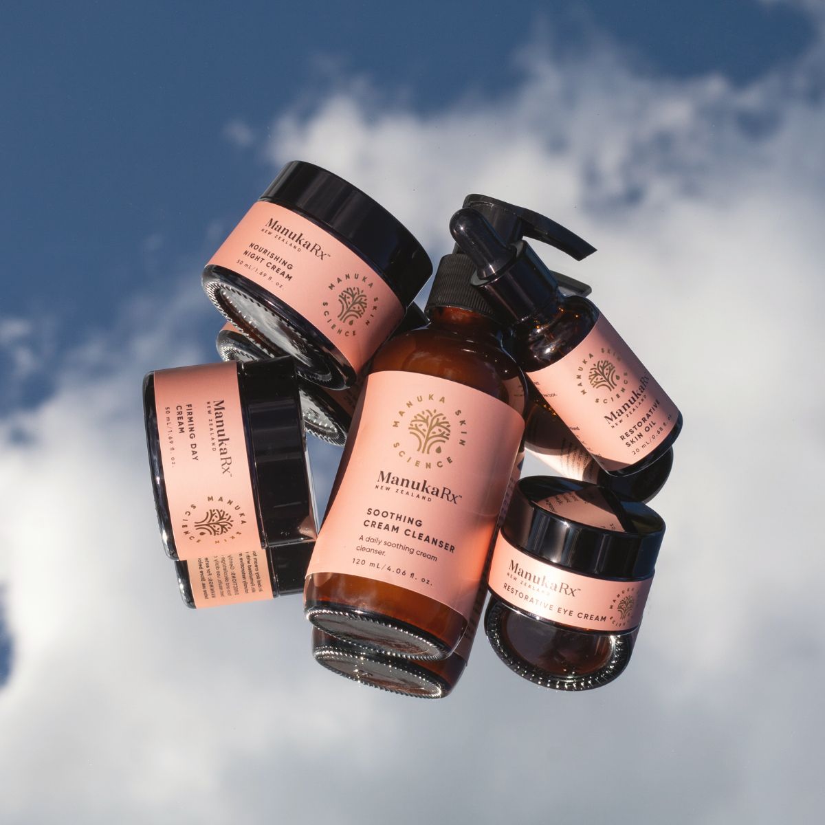 ManukaRx Rejuvenating Ritual set with blue sky and clouds background