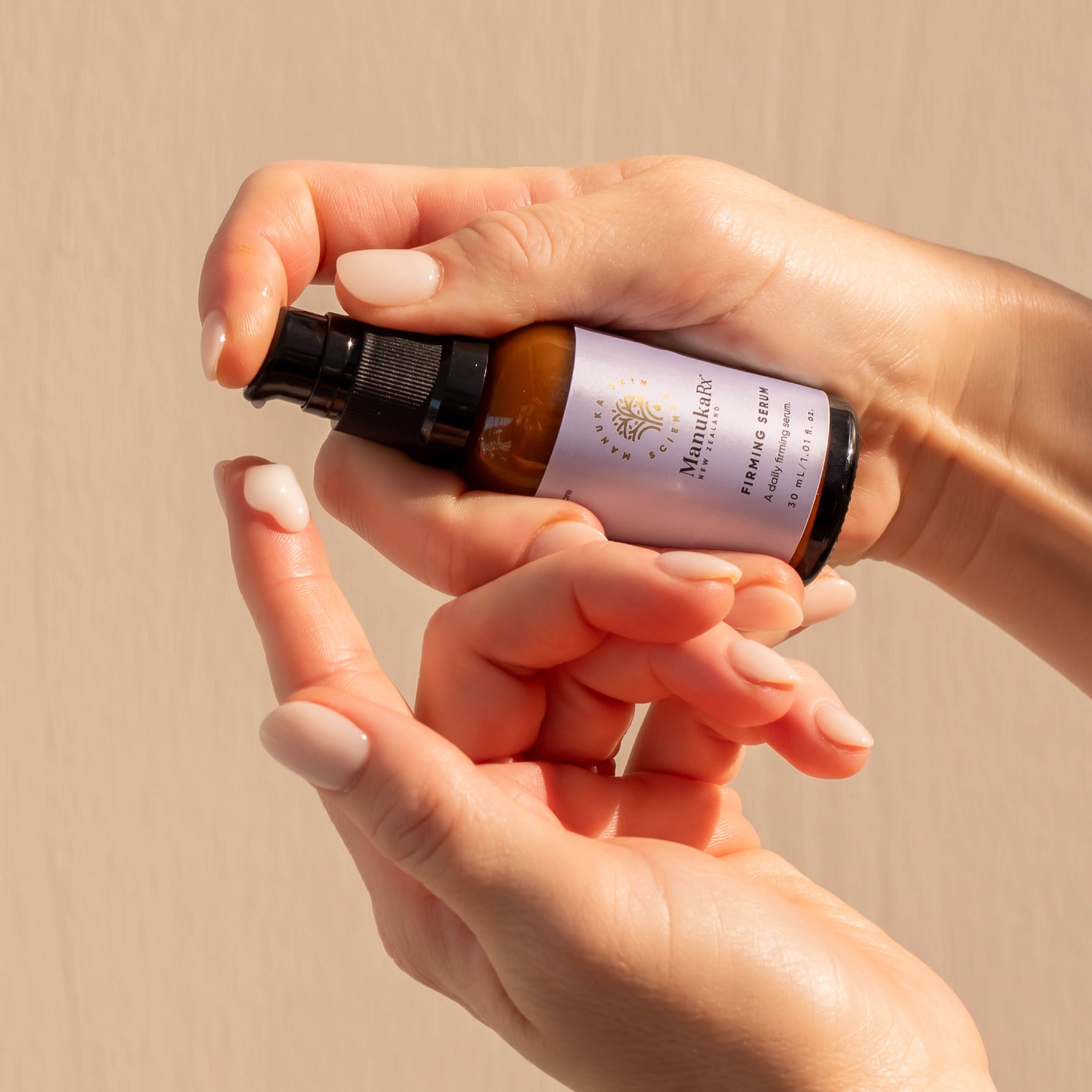 ManukaRx Firming Serum pumped out on to fingertip 