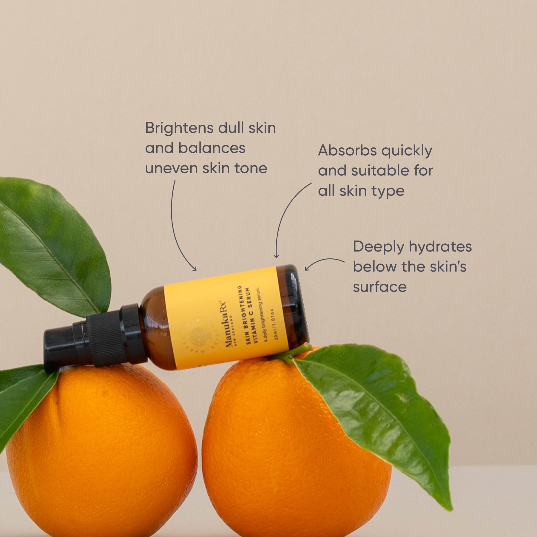 ManukaRx Skin Brightening Vitamin C Serum lying on top of oranges 